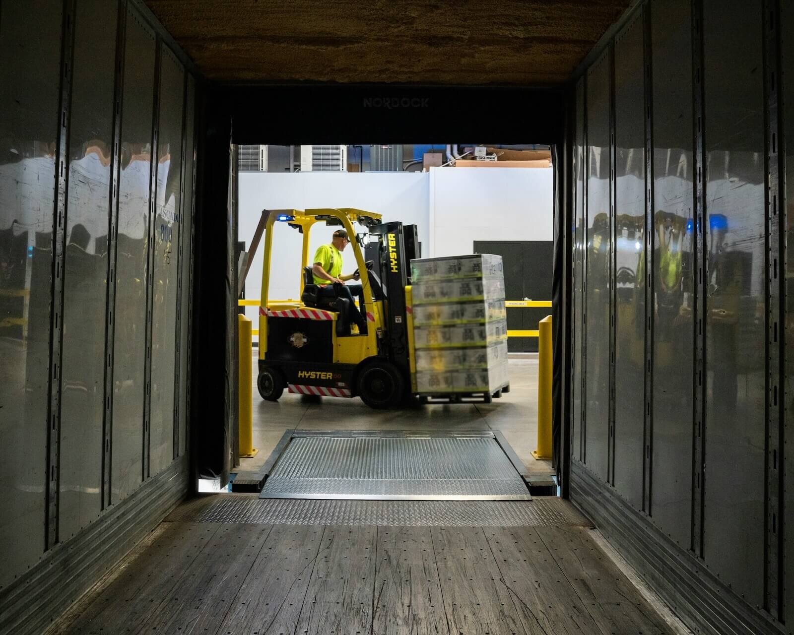 forklift loading mobile storage trailer